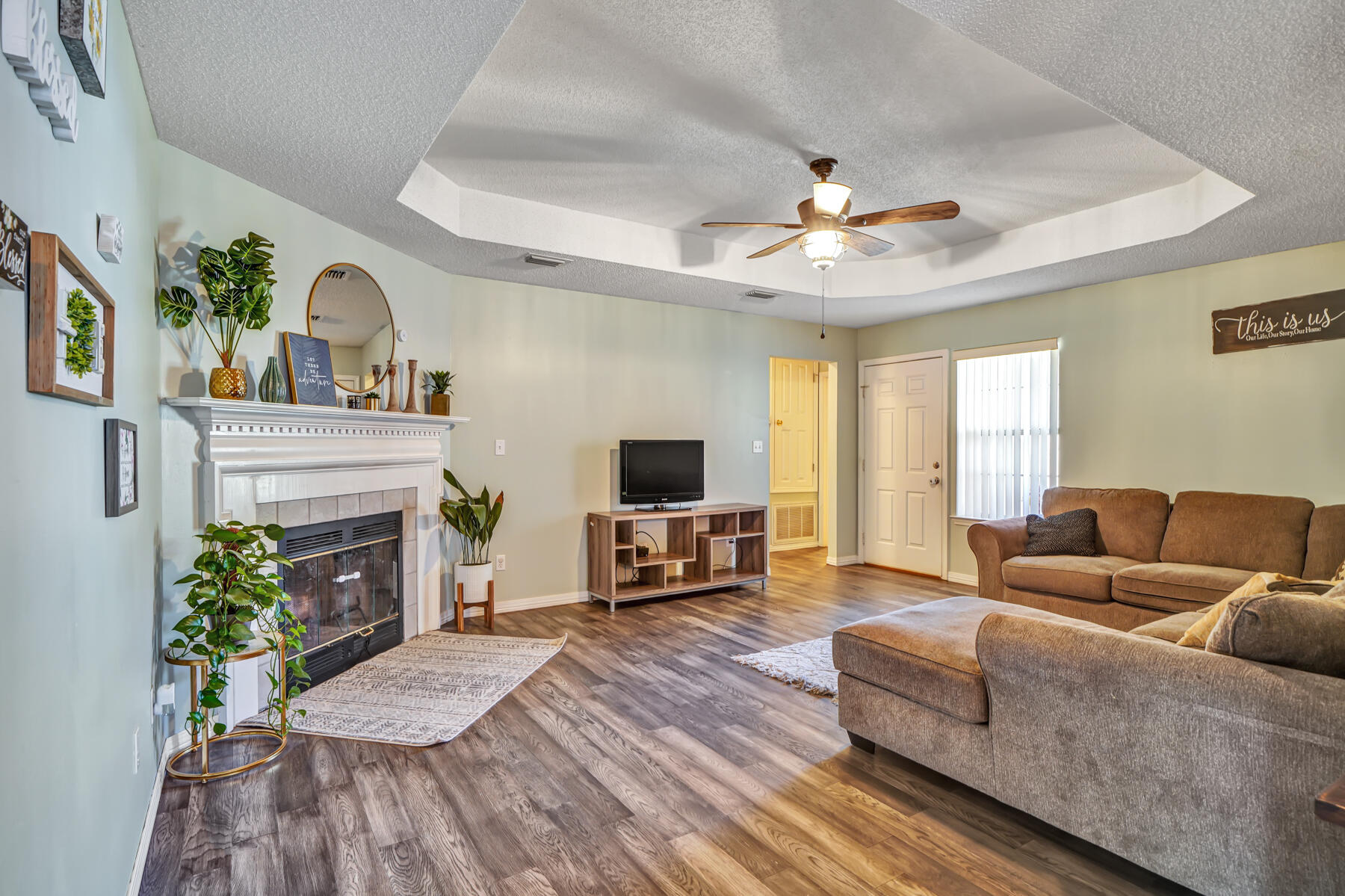 1787 Old Ranch Road Fort Walton Beach, FL 32547 - Photo 2 of 25 a living room with furniture a fireplace and a flat screen tv