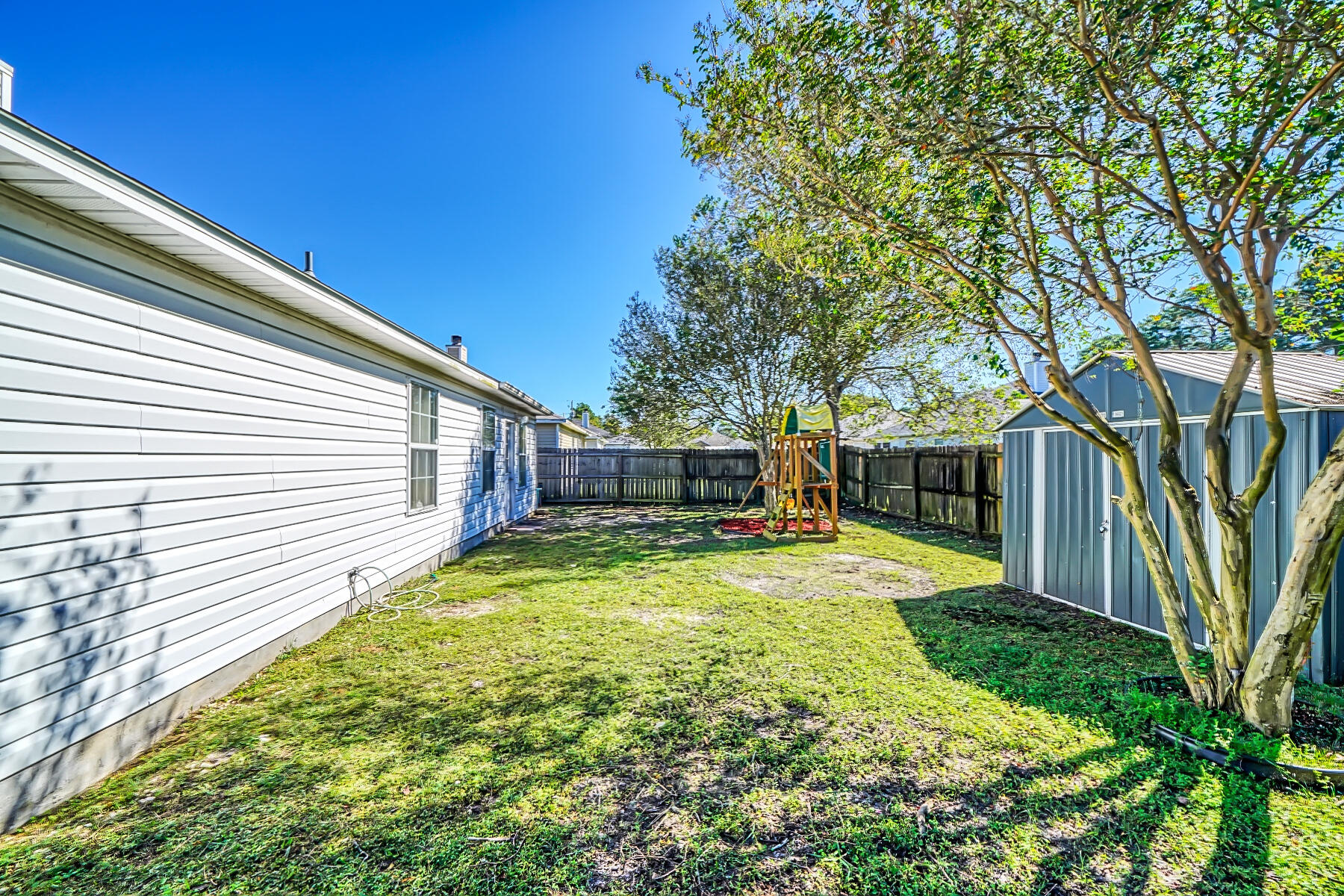 1787 Old Ranch Road Fort Walton Beach, FL 32547 - Photo 21 of 25 a view of a backyard with a large tree