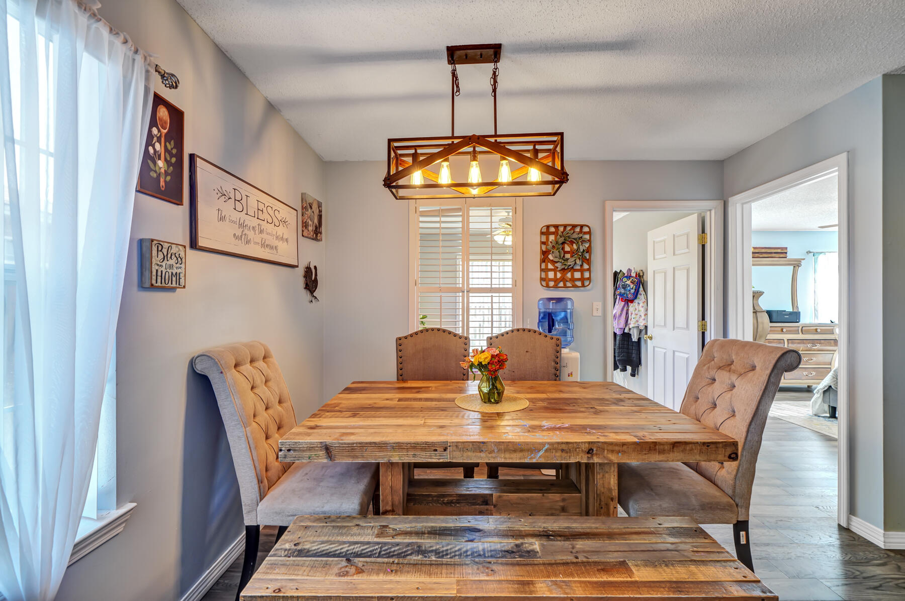 1787 Old Ranch Road Fort Walton Beach, FL 32547 - Photo 5 of 25 a view of a dining room with furniture window and wooden floor