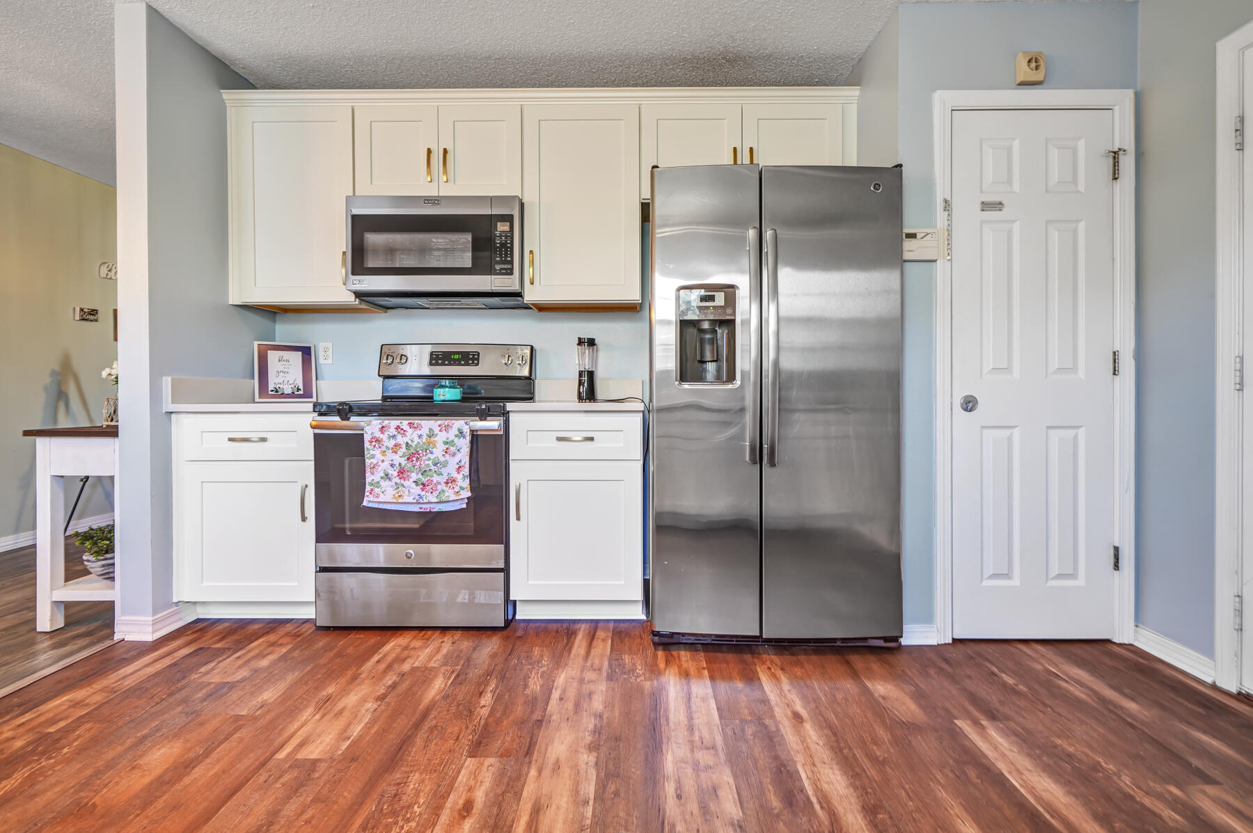 1787 Old Ranch Road Fort Walton Beach, FL 32547 - Photo 8 of 25 a kitchen with granite countertop a refrigerator and a stove top oven