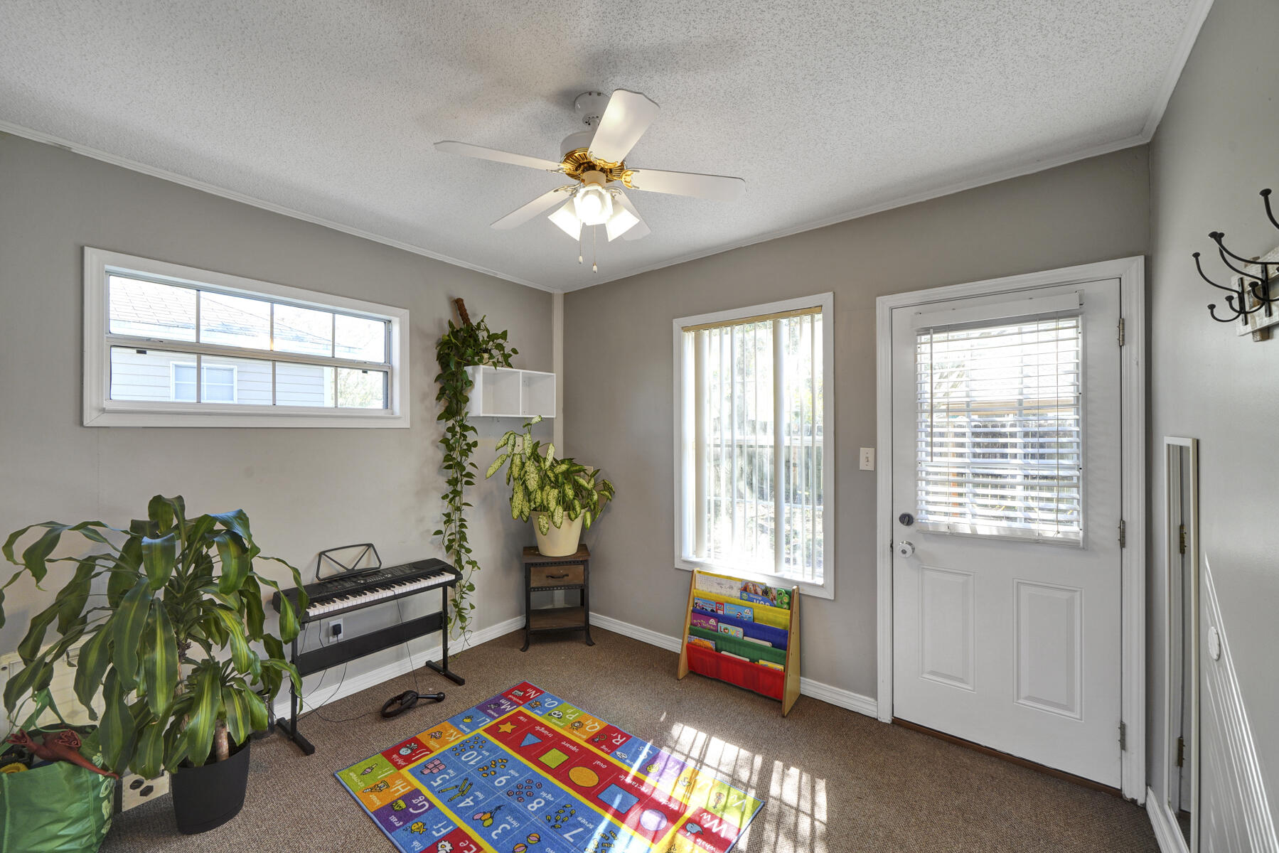 1787 Old Ranch Road Fort Walton Beach, FL 32547 - Photo 9 of 25 a bedroom with furniture and a potted plant