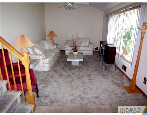 2 Rugby Road Colonia, NJ 07067 - Photo 2 of 15 a living room with furniture and a window