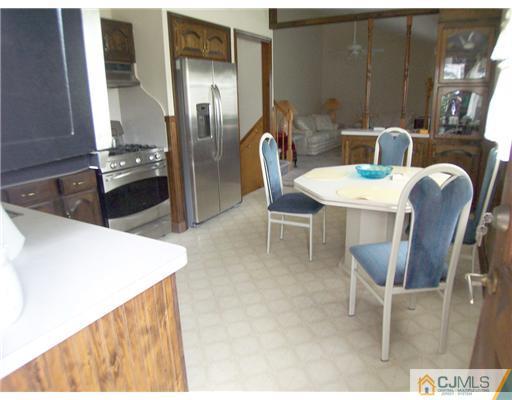 2 Rugby Road Colonia, NJ 07067 - Photo 5 of 15 a kitchen with a table and chairs