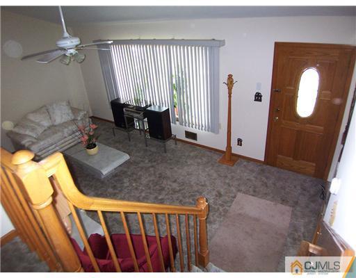 2 Rugby Road Colonia, NJ 07067 - Photo 6 of 15 a view of a livingroom with furniture and staircase