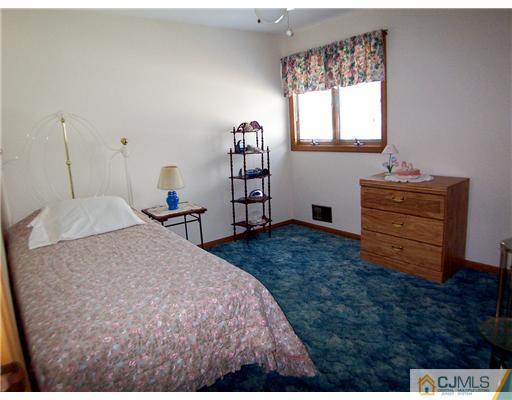2 Rugby Road Colonia, NJ 07067 - Photo 9 of 15 a bedroom with a bed and window
