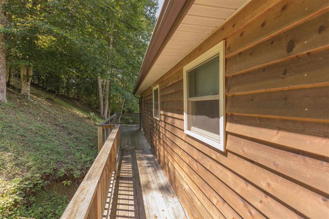 604 North Fork Road Amherst, VA 24521 - Photo 35 of 50 a view of balcony with wooden floor and fence next to a yard