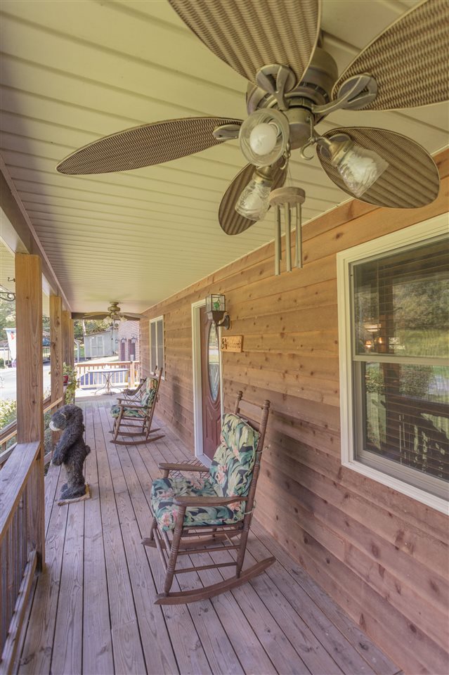 604 North Fork Road Amherst, VA 24521 - Photo 41 of 50 a view of a patio with table and chairs with wooden floor and fence