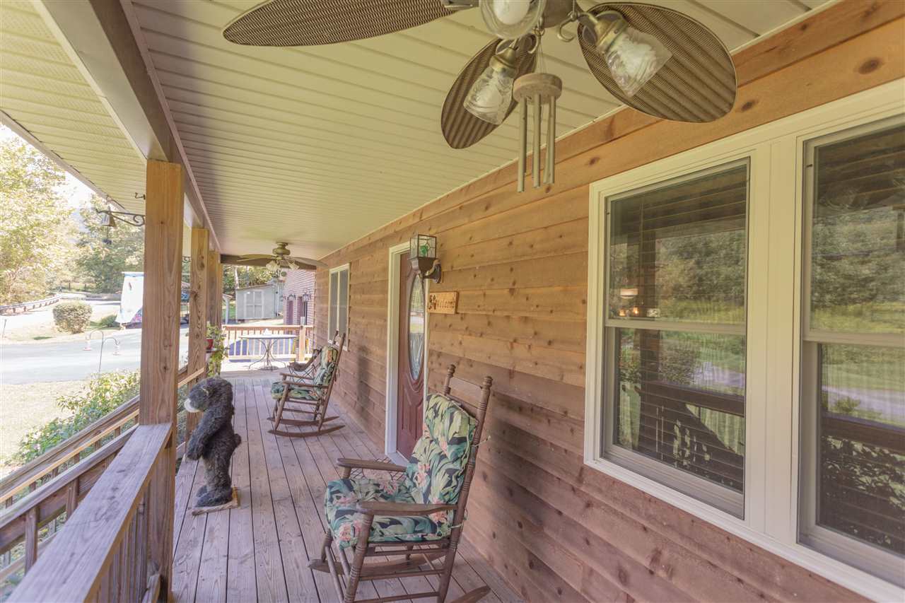 604 North Fork Road Amherst, VA 24521 - Photo 42 of 50 a balcony with furniture and wooden floor