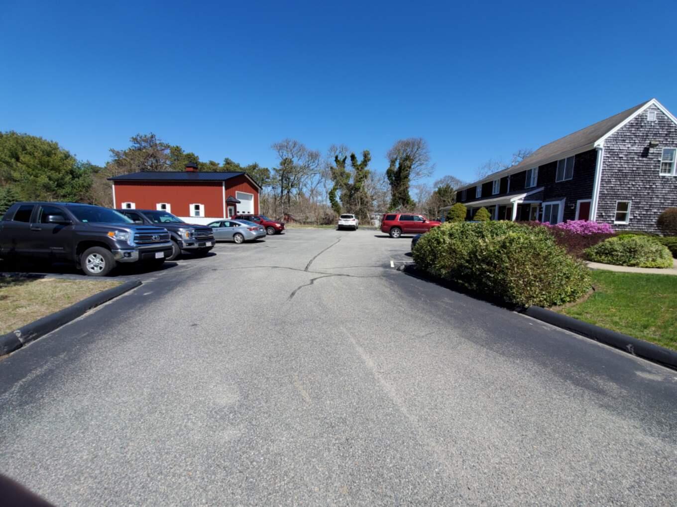 250-252 Underpass Road Brewster, MA 02631 - Photo 2 of 30 a view of a car park in front of a house
