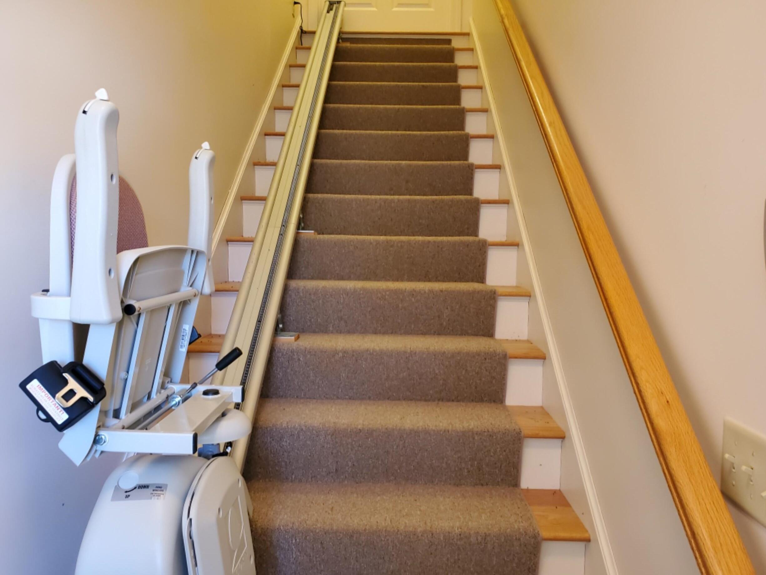 250-252 Underpass Road Brewster, MA 02631 - Photo 30 of 30 a view of staircase with wooden floor and lots of frames on wall