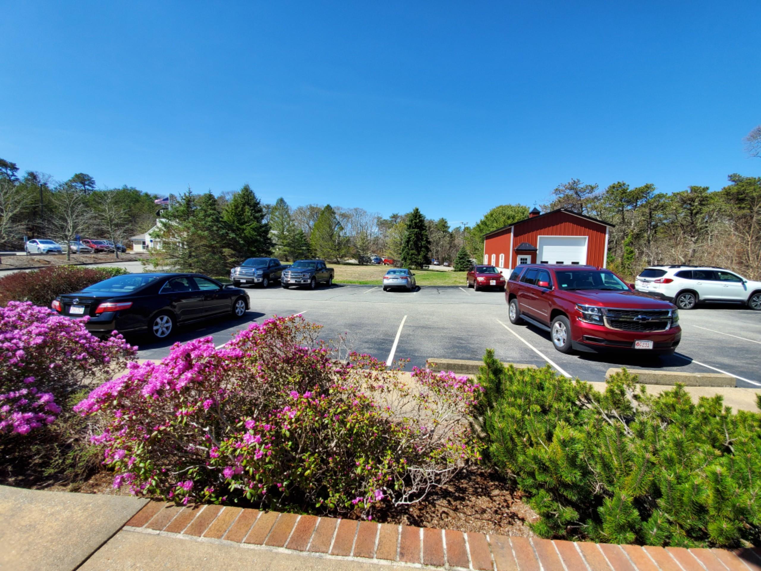 250-252 Underpass Road Brewster, MA 02631 - Photo 4 of 30 a view of a garden with cars parked