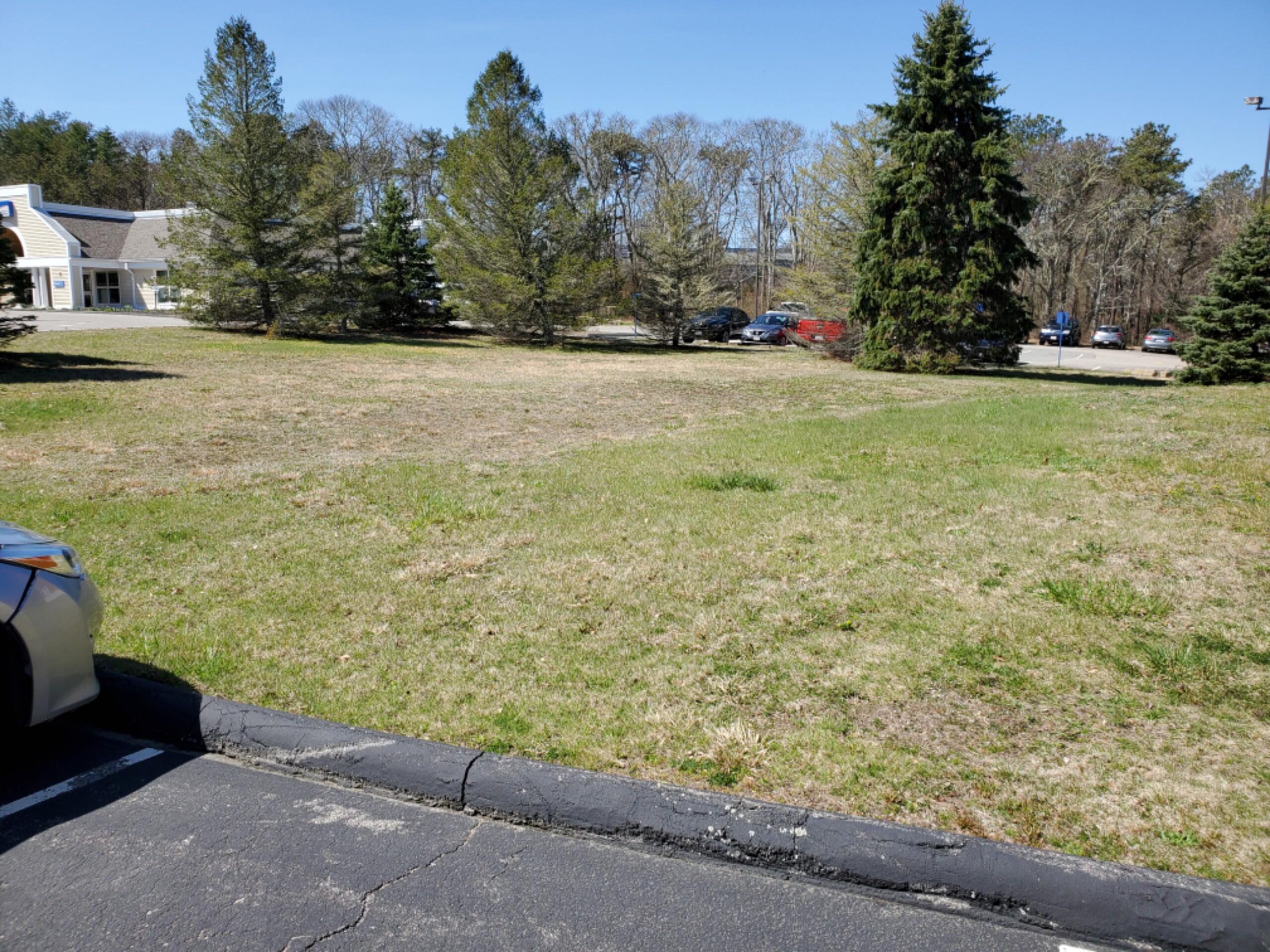 250-252 Underpass Road Brewster, MA 02631 - Photo 7 of 30 a view of a yard with an outdoor space