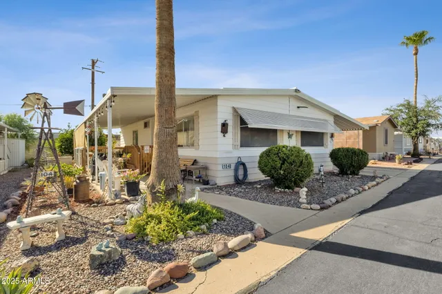 a view of a patio with a chairs and table in a patio
