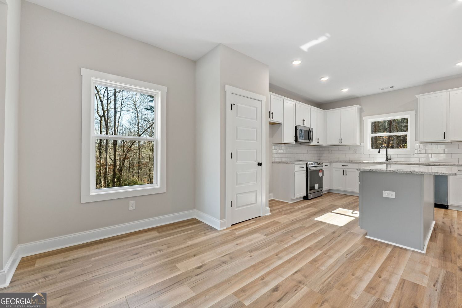 1578 English Road Forsyth, GA 31029 - Photo 11 of 40 a view of a kitchen with cabinets stainless steel appliances a window and a sink