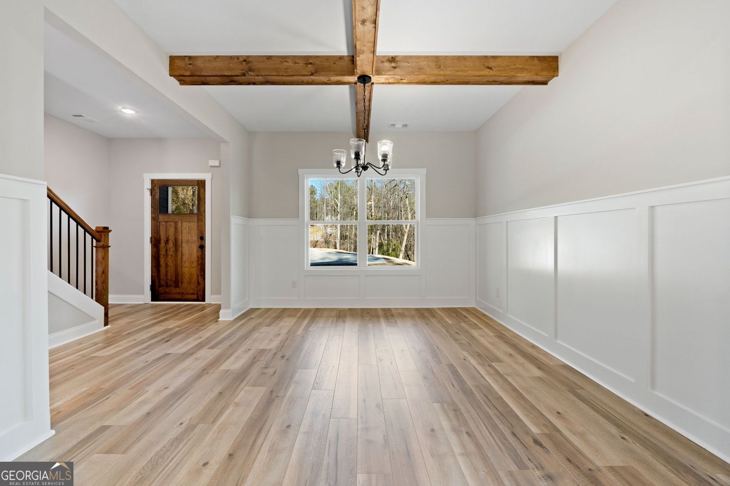 1578 English Road Forsyth, GA 31029 - Photo 7 of 40 a view of an empty room with wooden floor fridge and a window