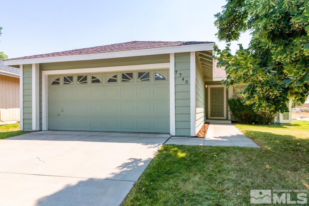 7540 Devonshire Lane Reno, NV 89511 - Photo 1 of 25 a front view of a house with a yard