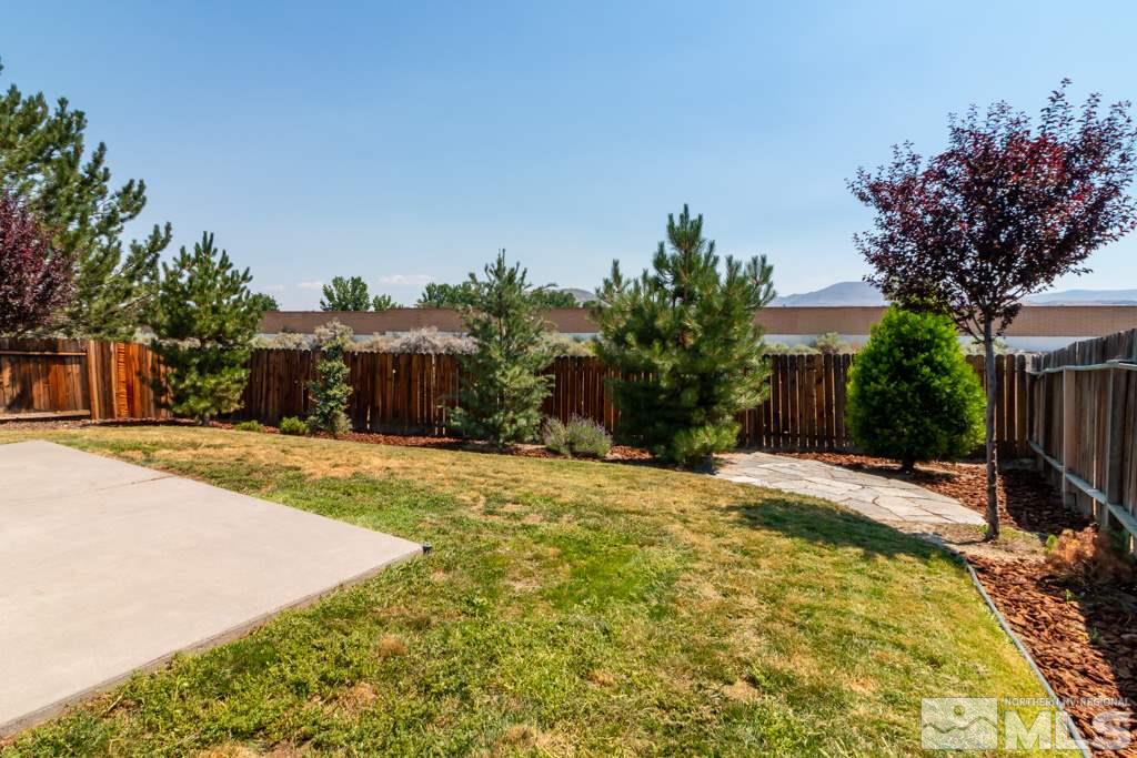 7540 Devonshire Lane Reno, NV 89511 - Photo 25 of 25 a front view of a house with a yard