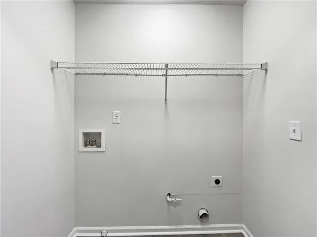 a bathroom with a shower and a window