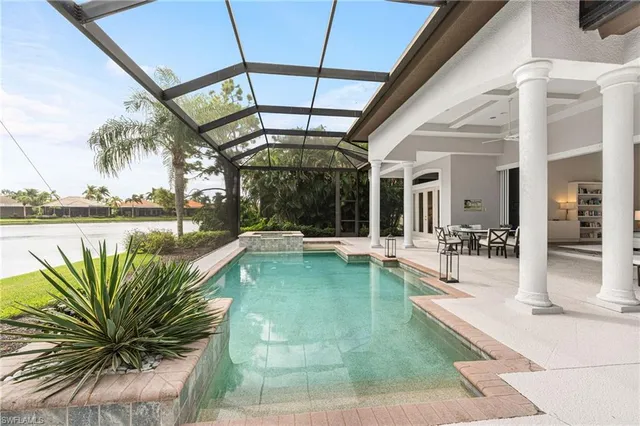 an aerial view of residential houses with outdoor space and river