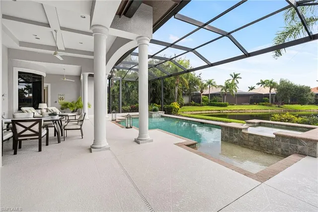 an aerial view of lake residential houses with outdoor space and swimming pool