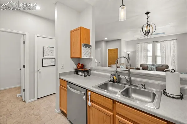 a kitchen with a sink and a refrigerator