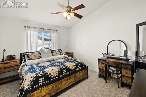 a bedroom with a bed and a table