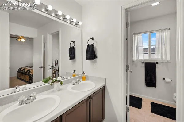 a bathroom with a sink double vanity and a mirror