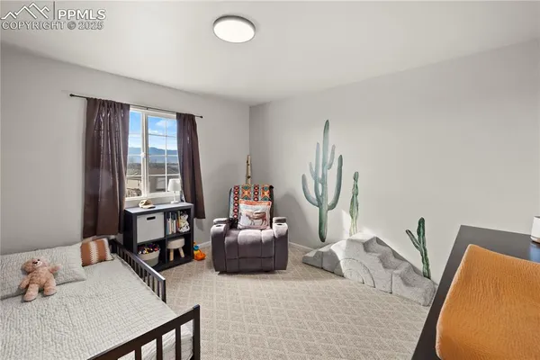 a bedroom with furniture and a window