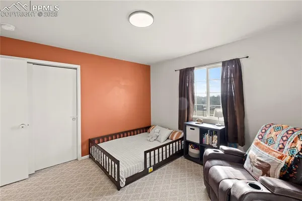 a bedroom with furniture and a window