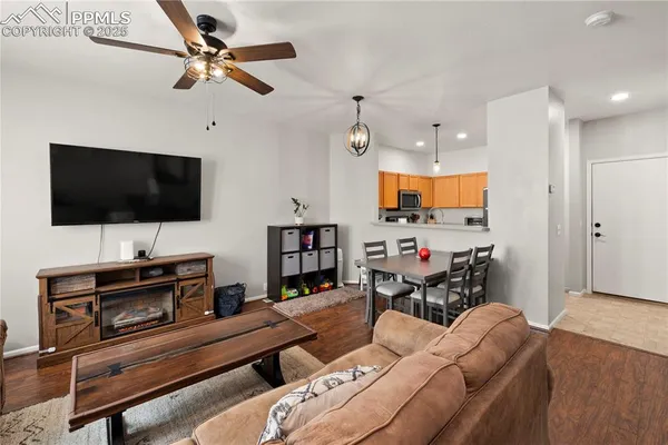 a living room with furniture and a flat screen tv
