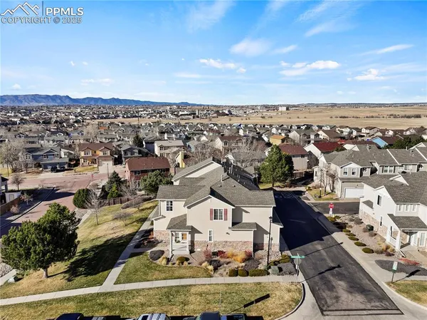 an aerial view of residential houses with outdoor space