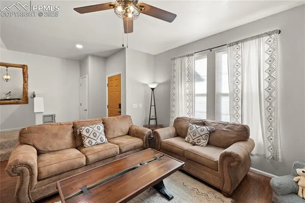 a living room with furniture and a large window