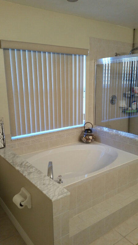 174 Southwest Sea Lion Road Port St. Lucie, FL 34953 - Photo 18 of 31 a bathroom with a granite countertop sink and a mirror
