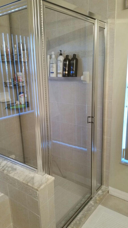 174 Southwest Sea Lion Road Port St. Lucie, FL 34953 - Photo 19 of 31 a bathroom with a glass shower door