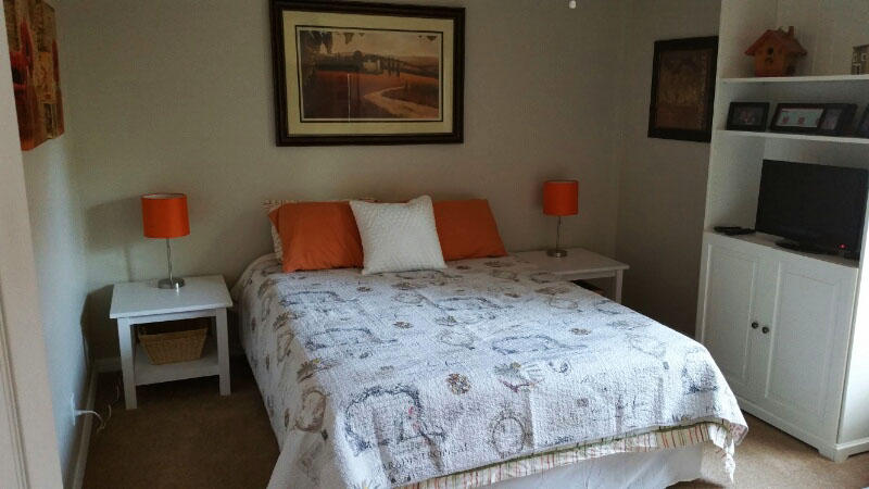 174 Southwest Sea Lion Road Port St. Lucie, FL 34953 - Photo 20 of 31 a bedroom with a bed and a television