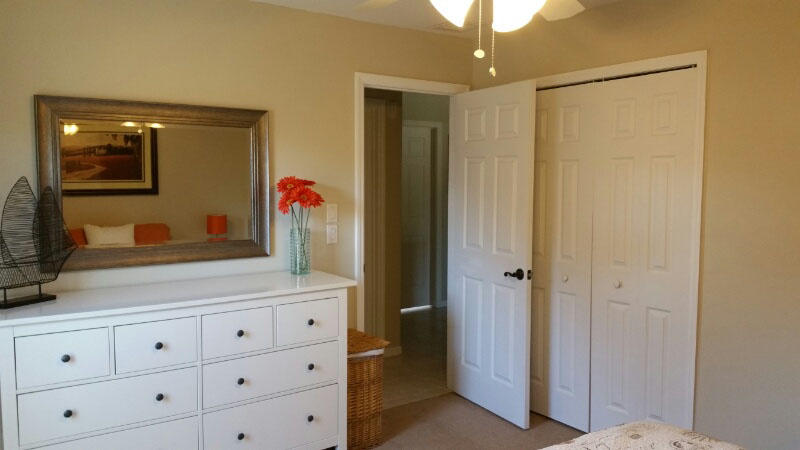 174 Southwest Sea Lion Road Port St. Lucie, FL 34953 - Photo 21 of 31 a bathroom with a mirror sink and vanity