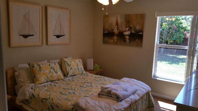 174 Southwest Sea Lion Road Port St. Lucie, FL 34953 - Photo 22 of 31 a bedroom with a bed and a window