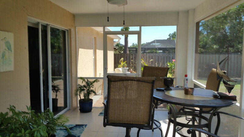 174 Southwest Sea Lion Road Port St. Lucie, FL 34953 - Photo 27 of 31 a view of a dining room with furniture window and outside view