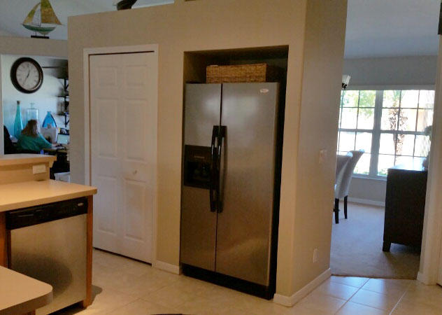 174 Southwest Sea Lion Road Port St. Lucie, FL 34953 - Photo 3 of 31 a view of a kitchen from the hallway