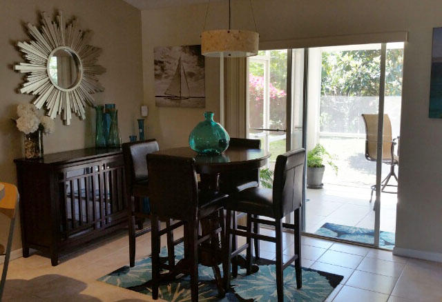 174 Southwest Sea Lion Road Port St. Lucie, FL 34953 - Photo 5 of 31 a view of a dining room with furniture window and outside view
