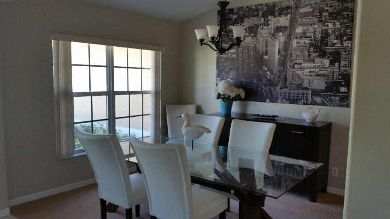 174 Southwest Sea Lion Road Port St. Lucie, FL 34953 - Photo 6 of 31 a view of a dining room with furniture and window