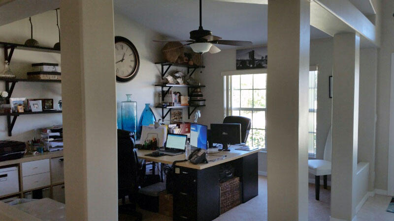 174 Southwest Sea Lion Road Port St. Lucie, FL 34953 - Photo 10 of 31 a view of a workspace with furniture and a window