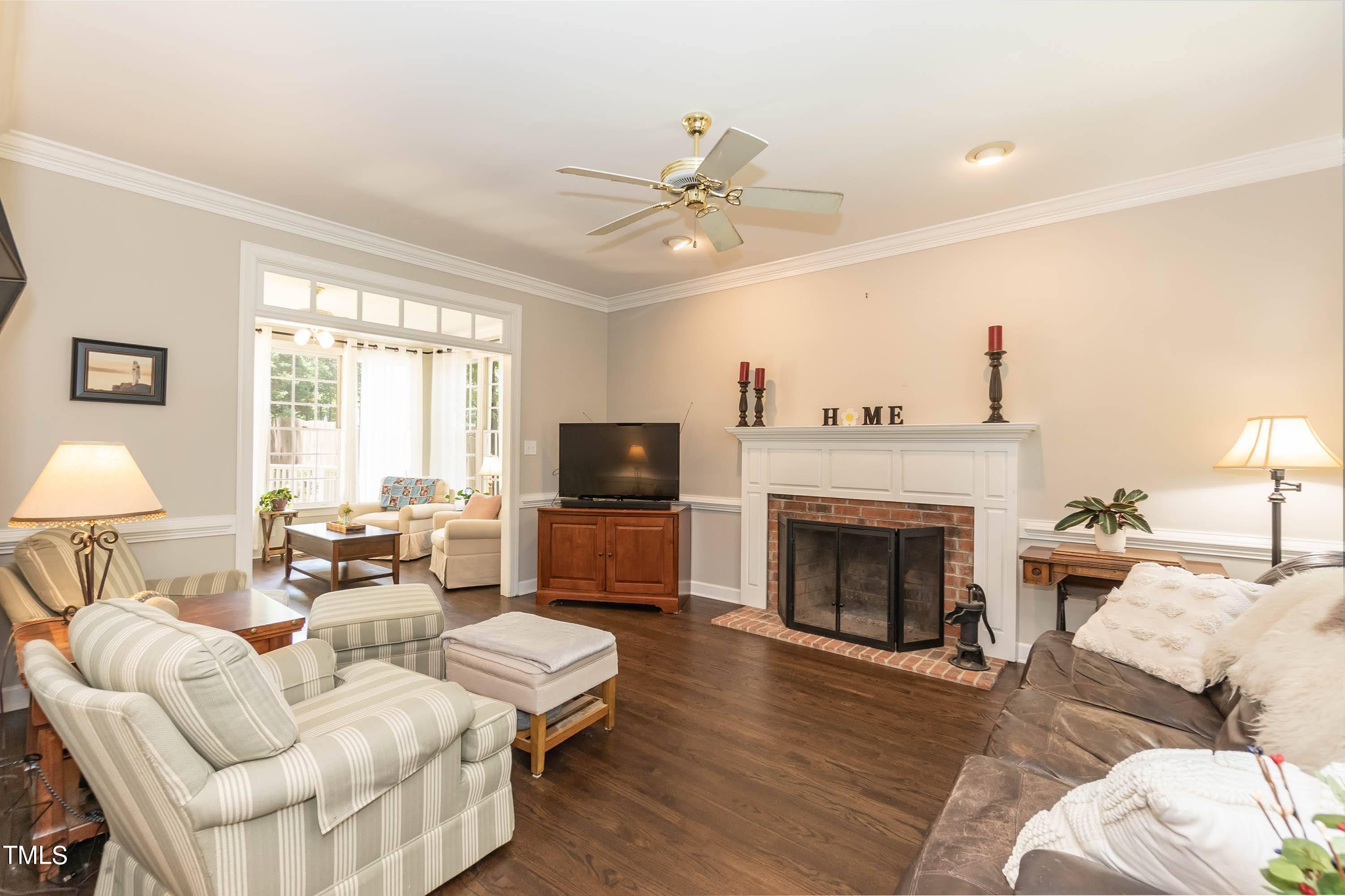 4112 Ridgebrook Bluffs Drive Raleigh, NC 27603 - Photo 14 of 40 Family room with wood burning fireplace