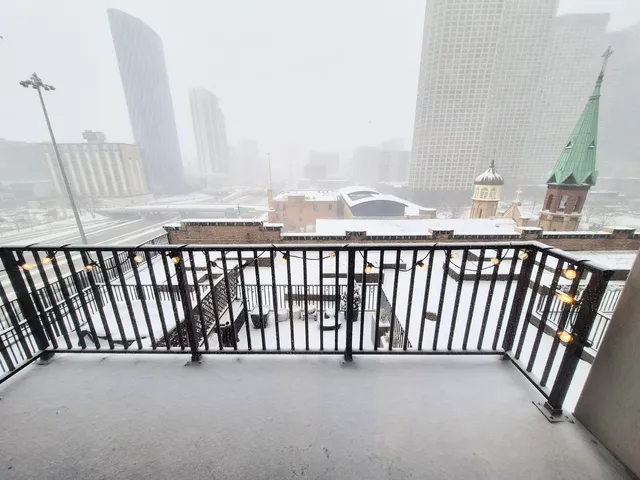 a view of a city skyline from a balcony