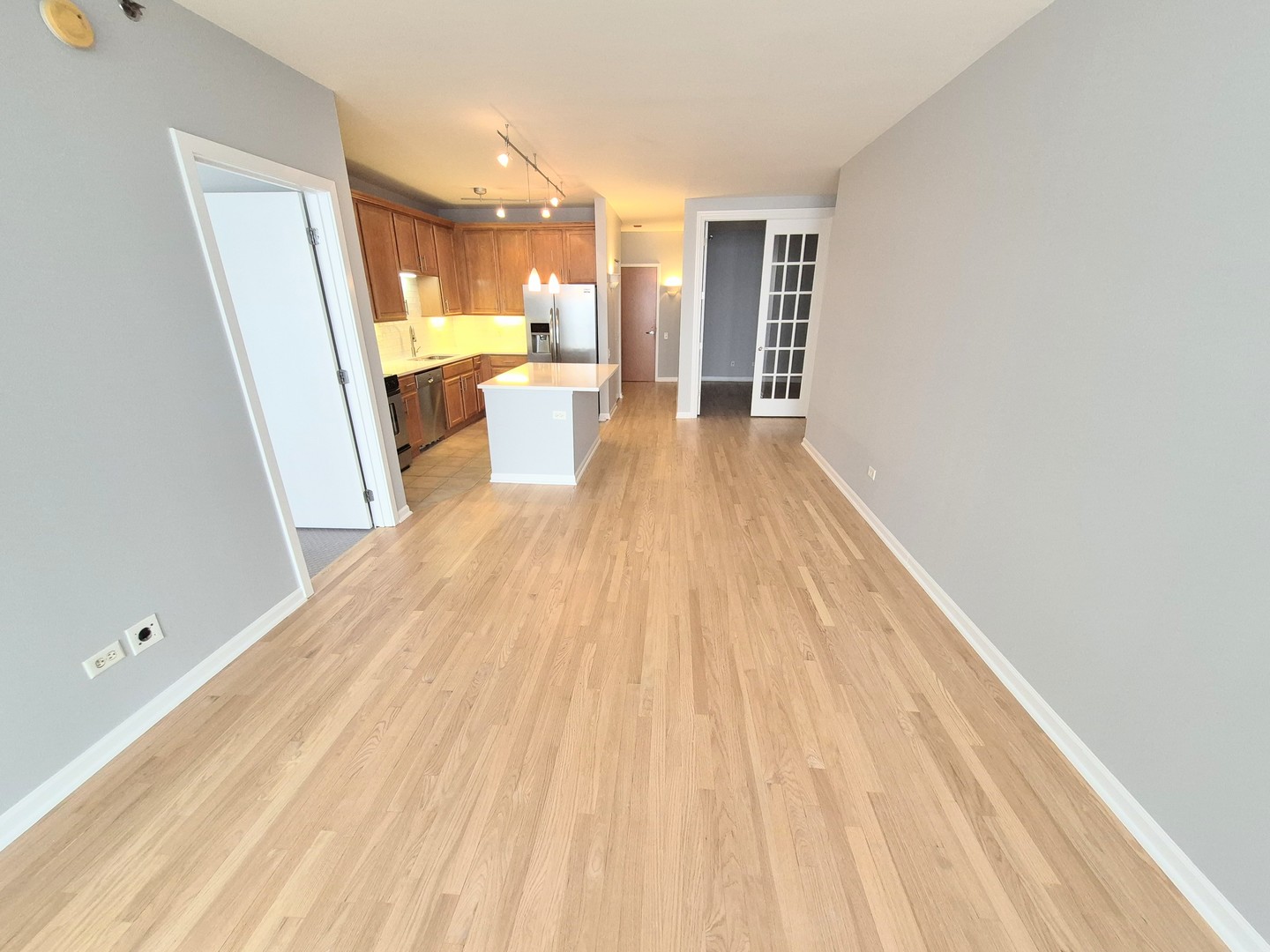210 South Desplaines Street, Unit 707 Chicago, IL 60661 - Photo 2 of 21 a view of a living room with a wooden floor