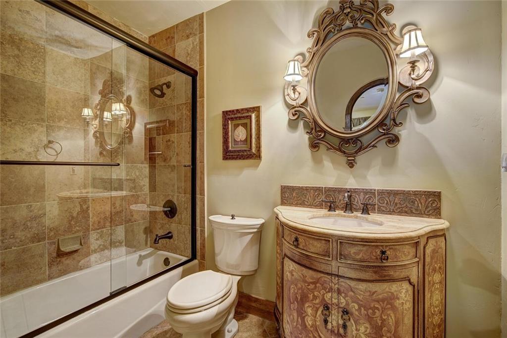 1065 4 O Clock Road Breckenridge, CO 80424 - Photo 22 of 35 a bathroom with a sink toilet and shower
