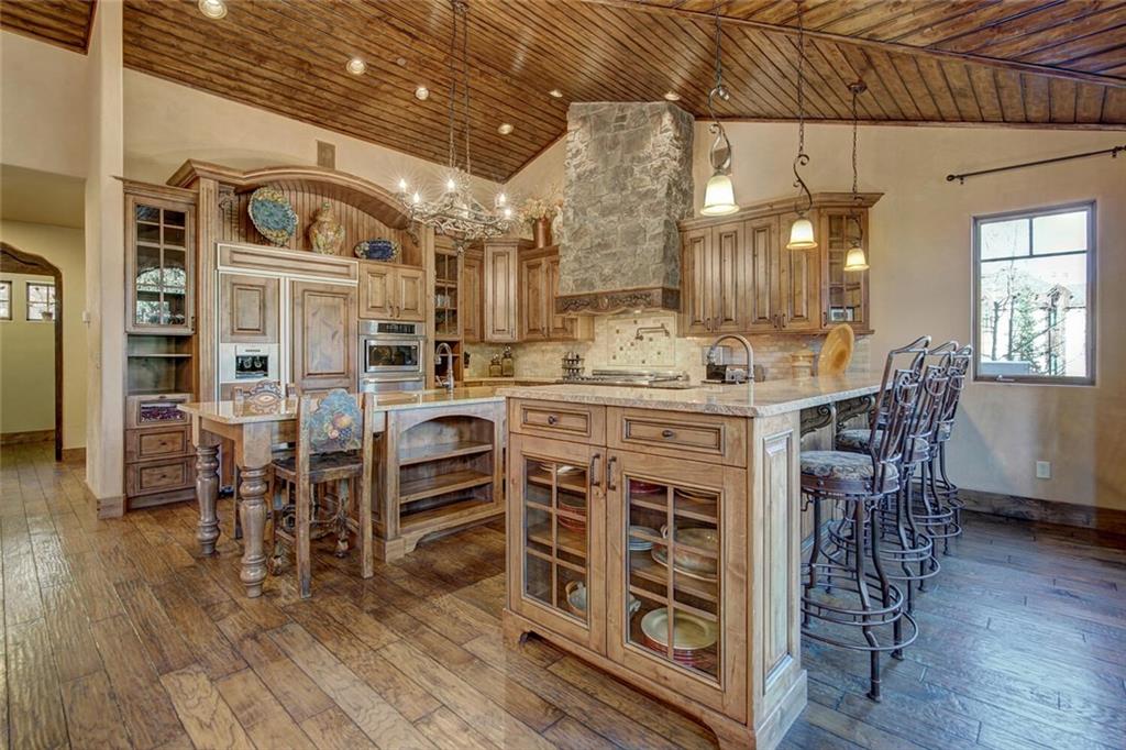 1065 4 O Clock Road Breckenridge, CO 80424 - Photo 25 of 35 a view of a dining room with furniture window and wooden floor