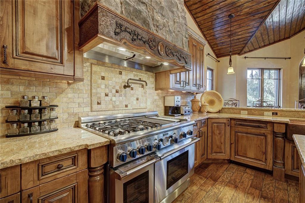 1065 4 O Clock Road Breckenridge, CO 80424 - Photo 26 of 35 a kitchen with stainless steel appliances granite countertop a stove and a sink