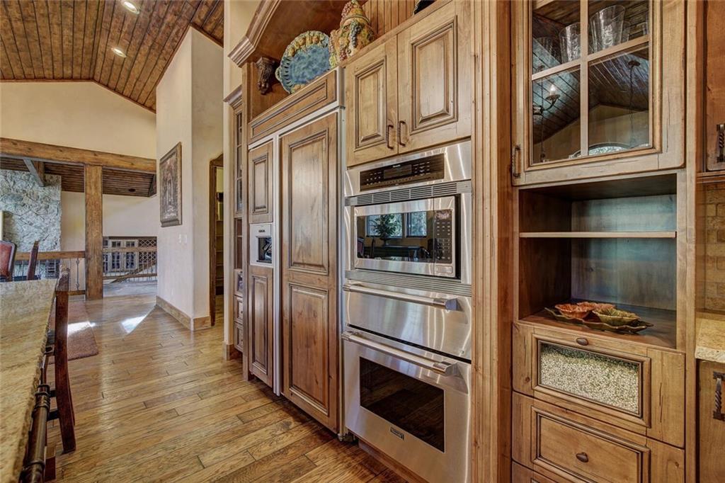 1065 4 O Clock Road Breckenridge, CO 80424 - Photo 27 of 35 a kitchen with stainless steel appliances granite countertop a stove and a refrigerator
