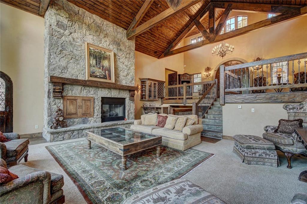 1065 4 O Clock Road Breckenridge, CO 80424 - Photo 28 of 35 a living room with furniture and a fireplace